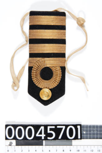 One of a pair of epaulettes from a Royal Australian Navy Captain's uniform, belonging to Captain L N Dine