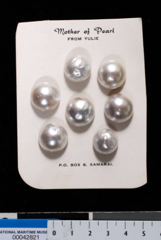 Seven cultured half pearls (or mabe pearls), with shell bases