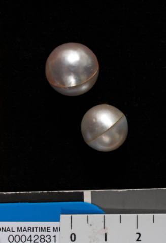 Two cultured spherical pearls