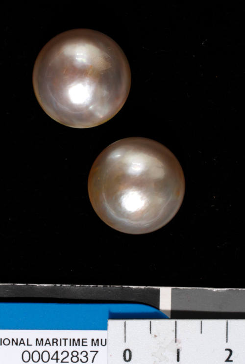 Two cultured half pearls (or mabe pearls) with shell bases