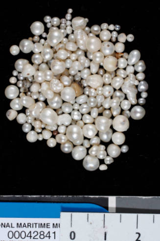 Two hundred and twenty-five small misshapen, natural and not yet fully formed spherical pearls
