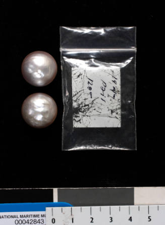 Two cultured half pearls (or mabe pearls) with shell bases