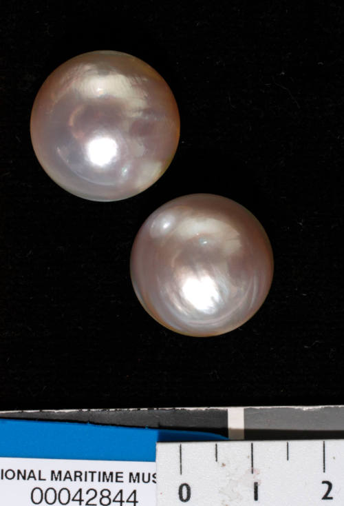 Two cultured half pearls (or mabe pearls) with shell bases