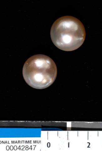 Two cultured half pearls (or mabe pearls) with shell bases