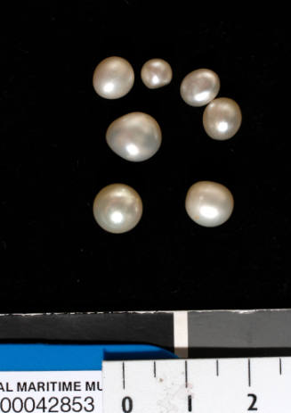 Seven small to medium sized spherical and misshapen pearls