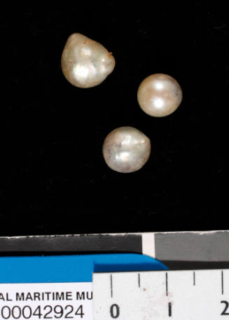 Three failed cultured pearls