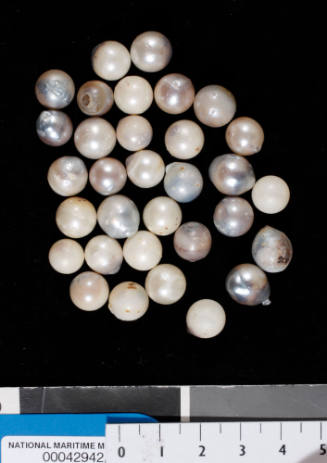 Thirty-two grey and white failed cultured pearls