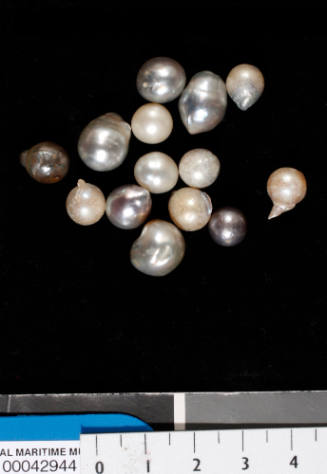 Fourteen failed cultured pearls of various colours and sizes