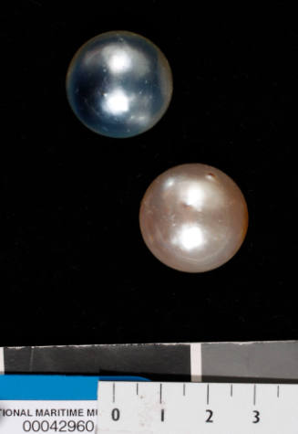 Two cultured half pearls (or mabe pearls)