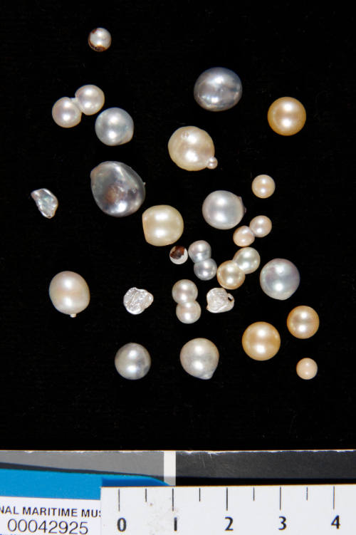 Twenty-five natural pearls of various sizes and colours