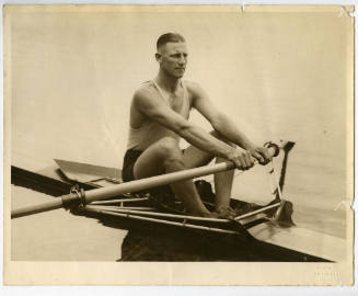 Bobby Pearce seated in a single scull