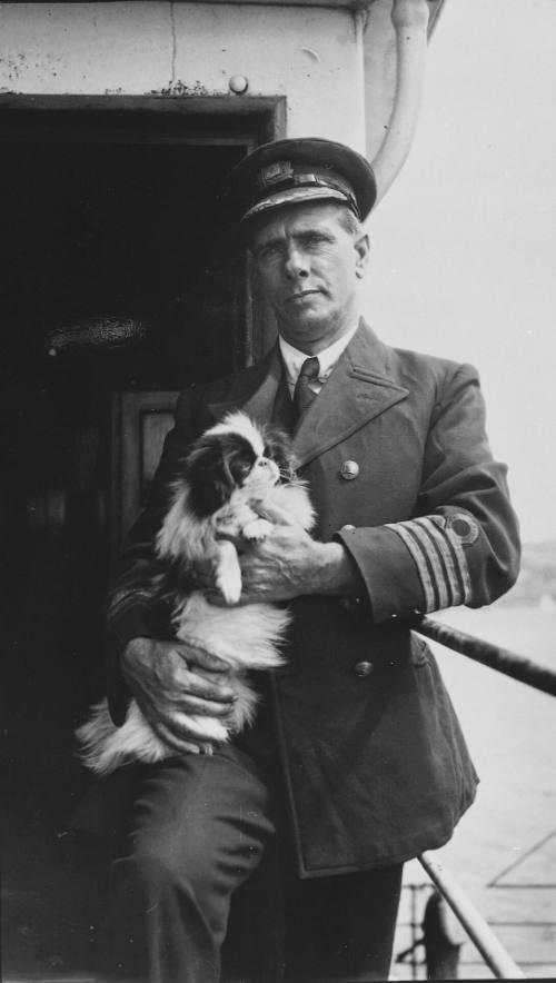 Shipmaster of the SS PURLEY with his Japanese Spaniel