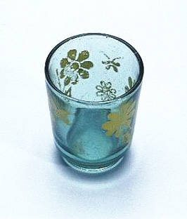 Drinking glass with yellow flowers, similar to those taken on board TU DO