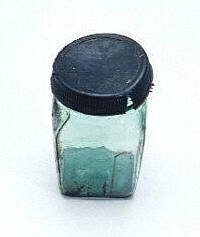 Glass storage jar with lid, similar to those used on TU DO