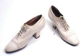 Women's pair of white leather shoes