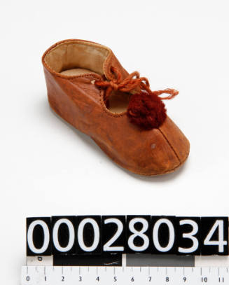 Doll's shoe - owned by child migrant Lily Knapton