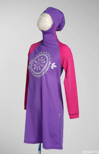 Burqini swimsuit top in pink and purple with circular motif on chest