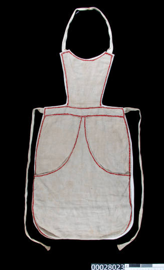 Apron worn by Lily Knapton, a child migrant who arrived on the SS RUNIC in 1909