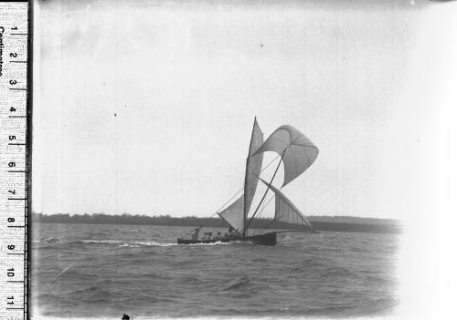 18-foot skiff under full sail on Sydney Harbour