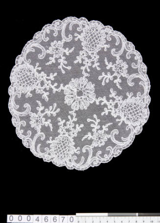 Machine embroidered doily