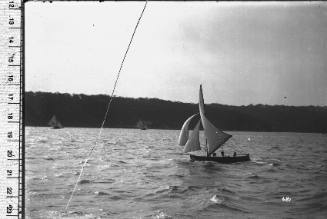 12-foot skiff sailing on Sydney Harbour