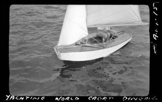 Yachting World cadet dinghy on Sydney Harbour