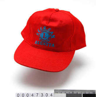 Red polyester baseball cap with a painted Lions Beer Can Regatta logo