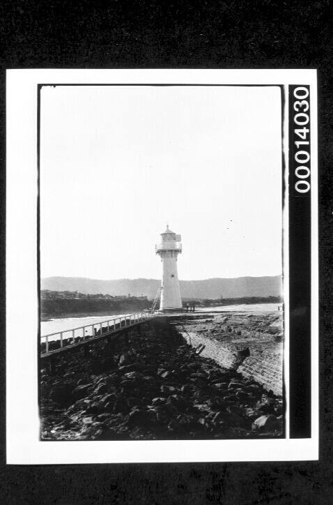 Lighthouse at end of breakwater, NSW coast