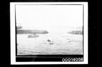 Vessels in a small breakwater harbour