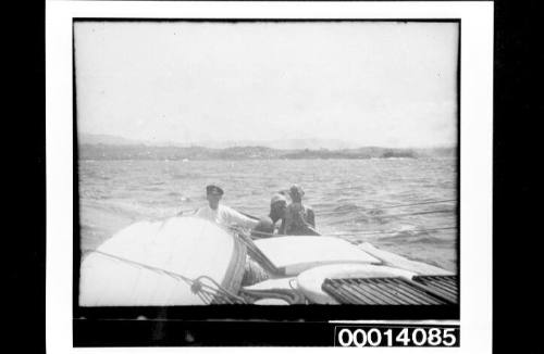 Four men under sail in a yacht