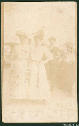 Postcard featuring a black and white photograph of Beatrice Kerr and a friend