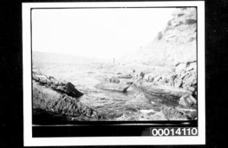 Man standing on a rocky foreshore