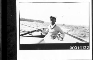 Harold Nossiter Snr in the cockpit of yacht UTIEKAH II under sail