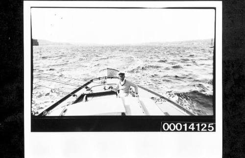 View of stern deck and cockpit of UTIEKAH II leaving the coast