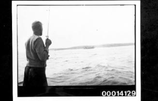 Young man fishing off NSW coast