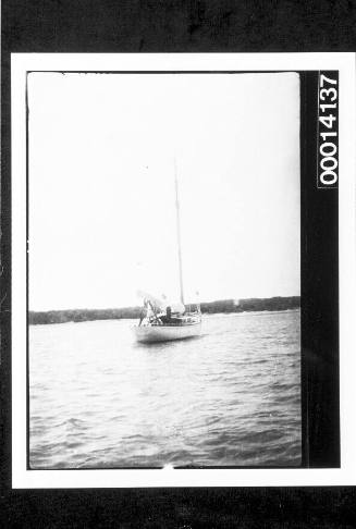 Stern view of yacht UTIEKAH II at anchor, shore in the distance