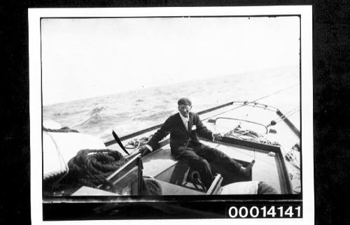 Harold Nossiter Snr in the cockpit of yacht UTIEKAH II