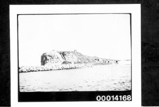 Rocky headland and long breakwater