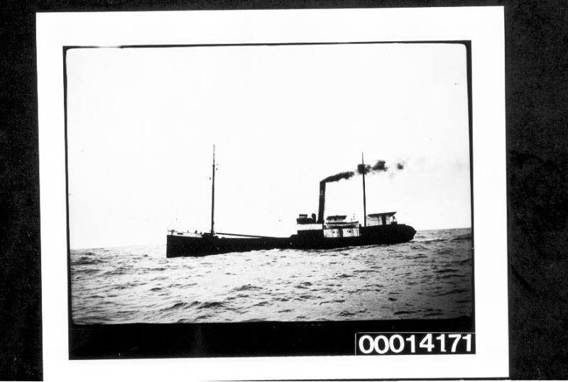 Port Side View Of A Small Cargo Ship At Sea – Works – Collections.sea 