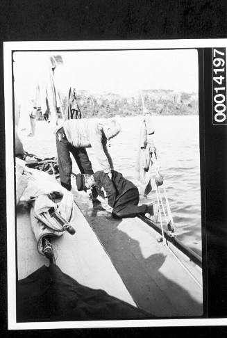 Helping Harold Nossiter Snr aboard his yacht UTIEKAH II