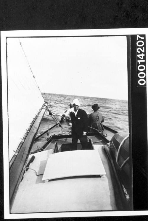 Man standing at the cockpit of yacht UTIEKAH II at sea