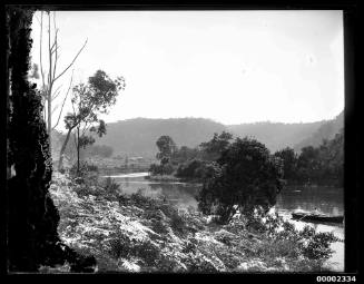 Man in a boat, possibly on the Hawkesbury River near Singletons Mill NSW