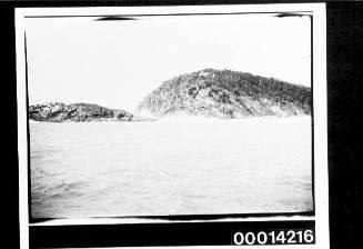 Sailing past a rocky foreshore