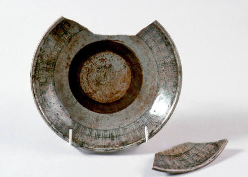 Block printed ceramic plate with green and brown glaze