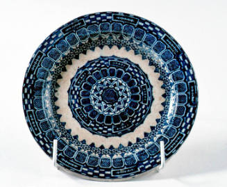 Ceramic plate with blue transfer design