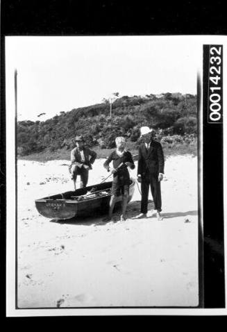 Crew of UTIEKAH II ashore with a dinghy, bushland behind
