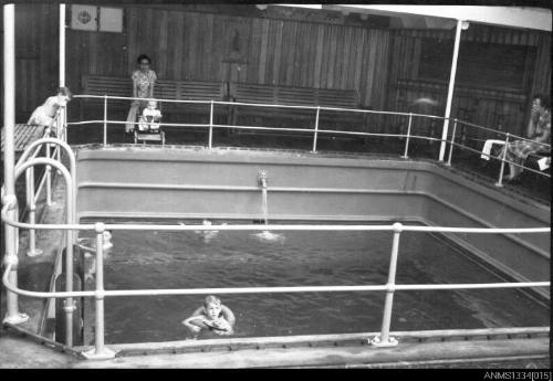 Negative of the Athey children in the ships swimming pool