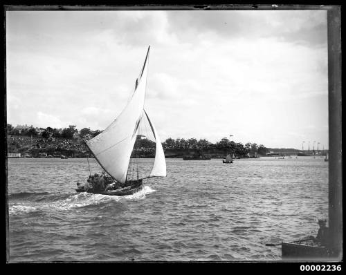 22-footer ROSETTA on Sydney Harbour, New South Wales, with sailing vessels visible in the background