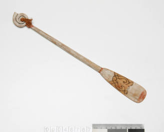 Wooden paddle from model of five-part outrigger canoe