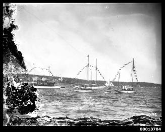 Three yachts thought to have been dressed for a regatta